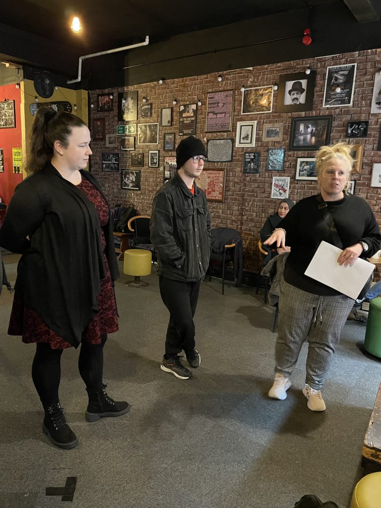 Three people from Reality Theatre talking